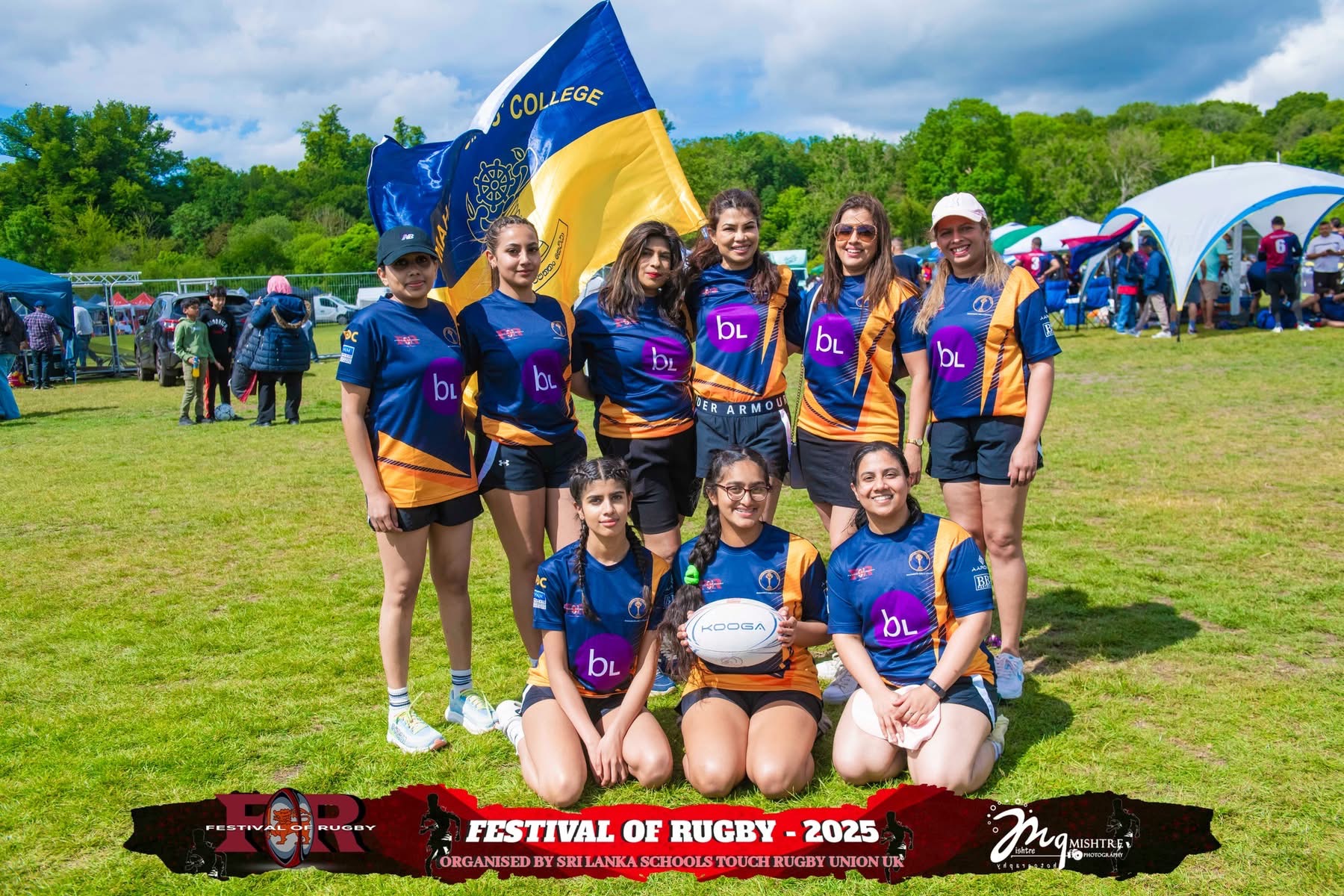 Women's rugby team posing with a school flag and rugby ball at Festival of Rugby 2025